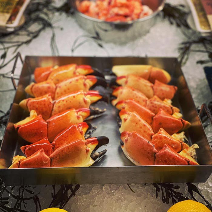 image of a tray of claws on ice